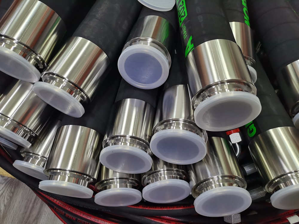 Close-up of capped clamp-style metal ends on V-ZEN EPDM hose assembly examples; exact clamp standard unverified.