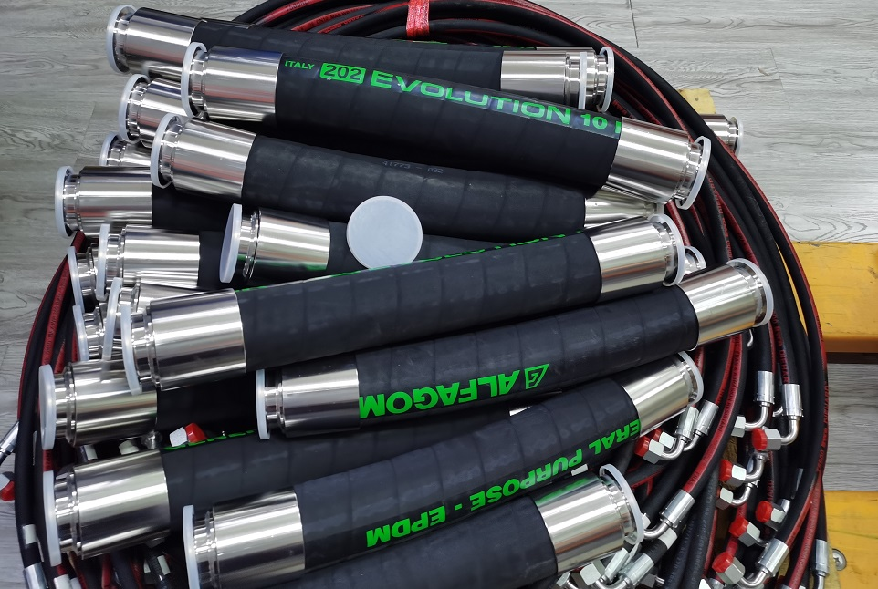 V-ZEN pictured 202AA-branded EPDM hose assemblies with stainless-looking sanitary clamp ends; multiple lengths shown, not one exact assembly order code.